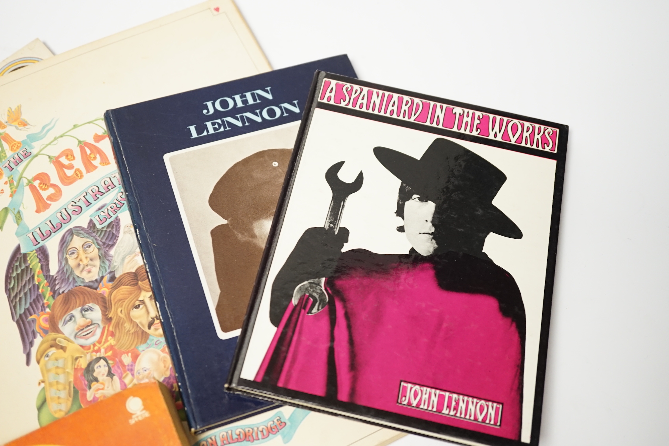 Four The Beatles related books; John Lennon; a Spaniard in the Works (First Edition 1965), John Lennon; In His Own Write (First Edition 1964), Yoko Ono; Grapefruit (First Sphere Books edition 1971), The Beatles, Illustra